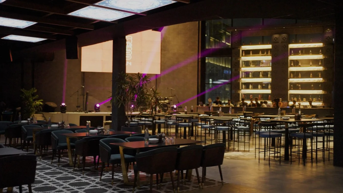 The indoor stage, bar, and seating at Akan