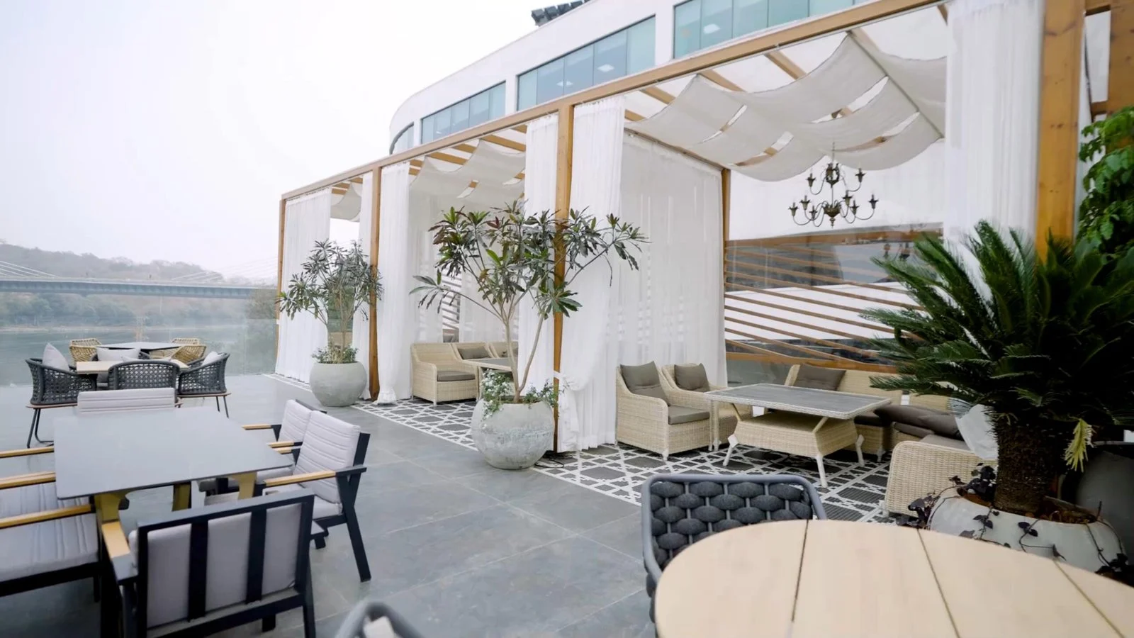 Akan’s bright open-air terrace overlooking the lake in daylight